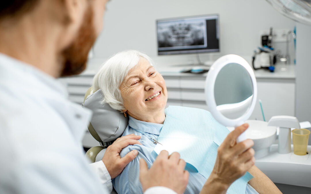 elderly woman smiling after getting dental implants
