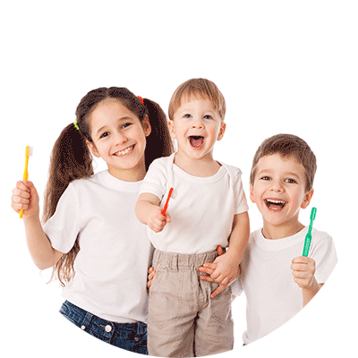 three kids holding toothbrushes