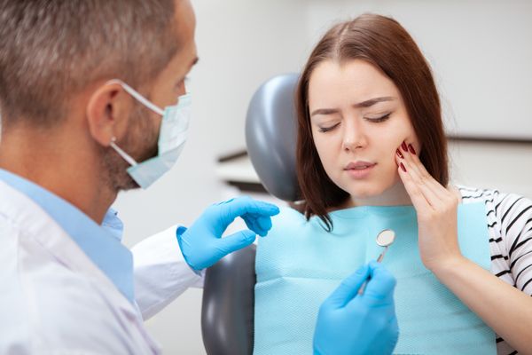 Woman experiencing dental pain